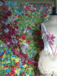 Jans dress with floral train draped over Liz's Papier mache picture